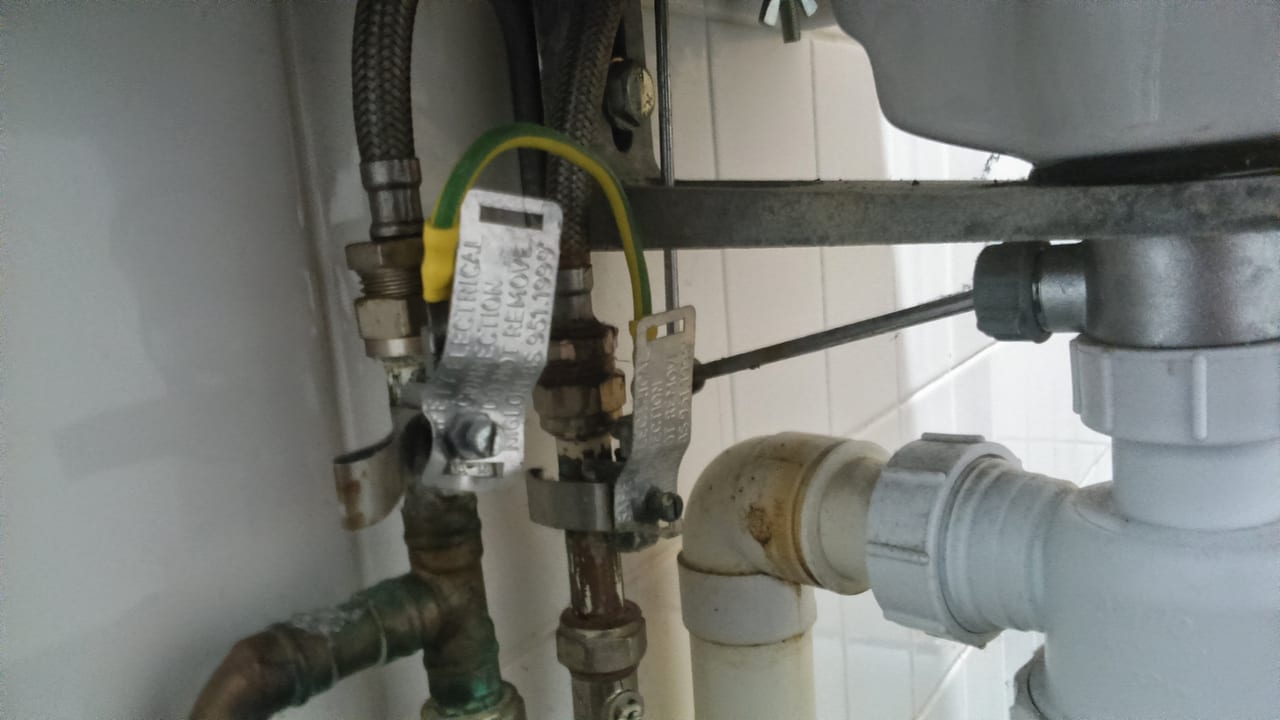 Drain trap and supply connections beneath a sink